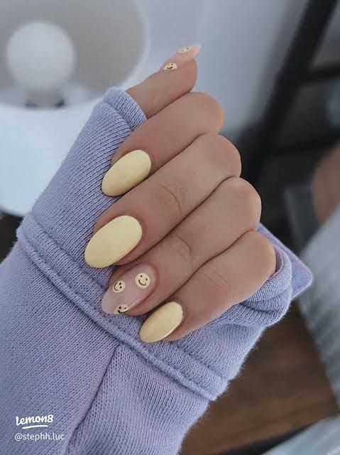 Subtle Smiley Accents on Pale Yellow — Smiley Face Nails