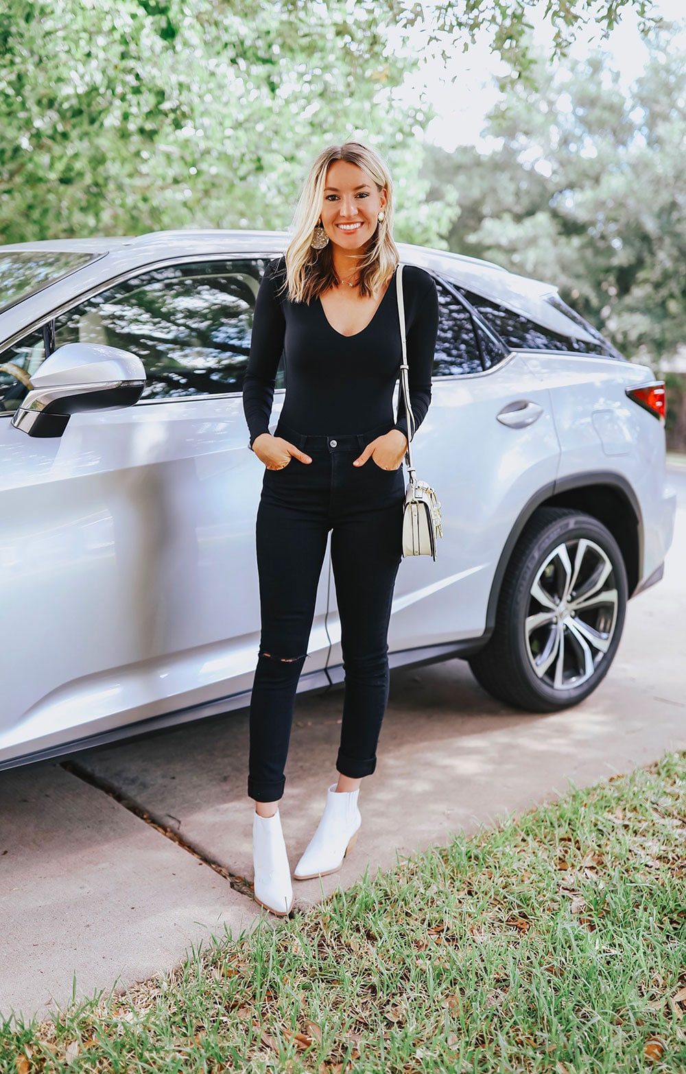 Casual Black Top with Ripped Jeans and White Boots Casual Black Top with Ripped Jeans and White Boots — Girls Night Out Outfits