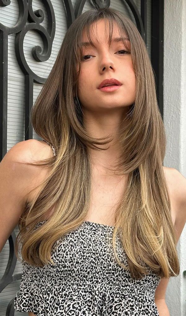 Mid-Back Layers With Wispy Bangs Mid-Back Layers With Wispy Bangs — Haircuts for Square Faces