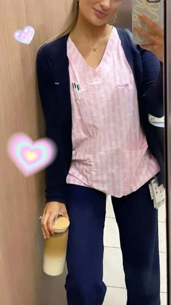 Navy Cardigan Over Striped Scrub Top and Pants Navy Cardigan Over Striped Scrub Top and Pants — Nurse Outfits