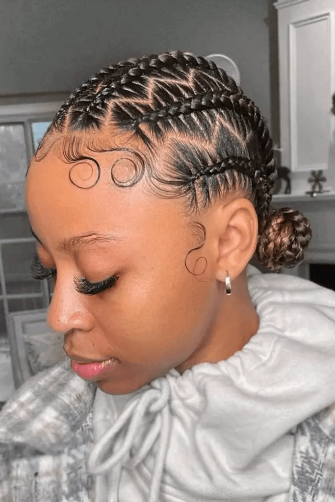 Geometric Cornrows With Side-Swept Bangs and Buns