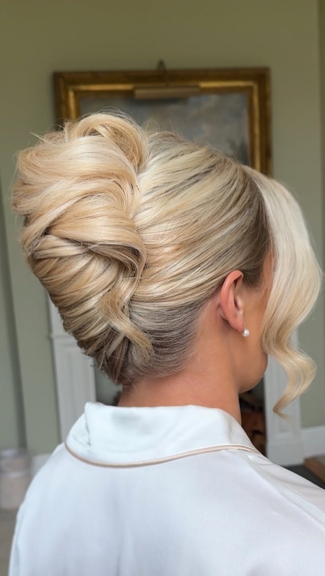 Mid-Back Voluminous Blonde Wavy French Twist Updo Mid-Back Voluminous Blonde Wavy French Twist Updo