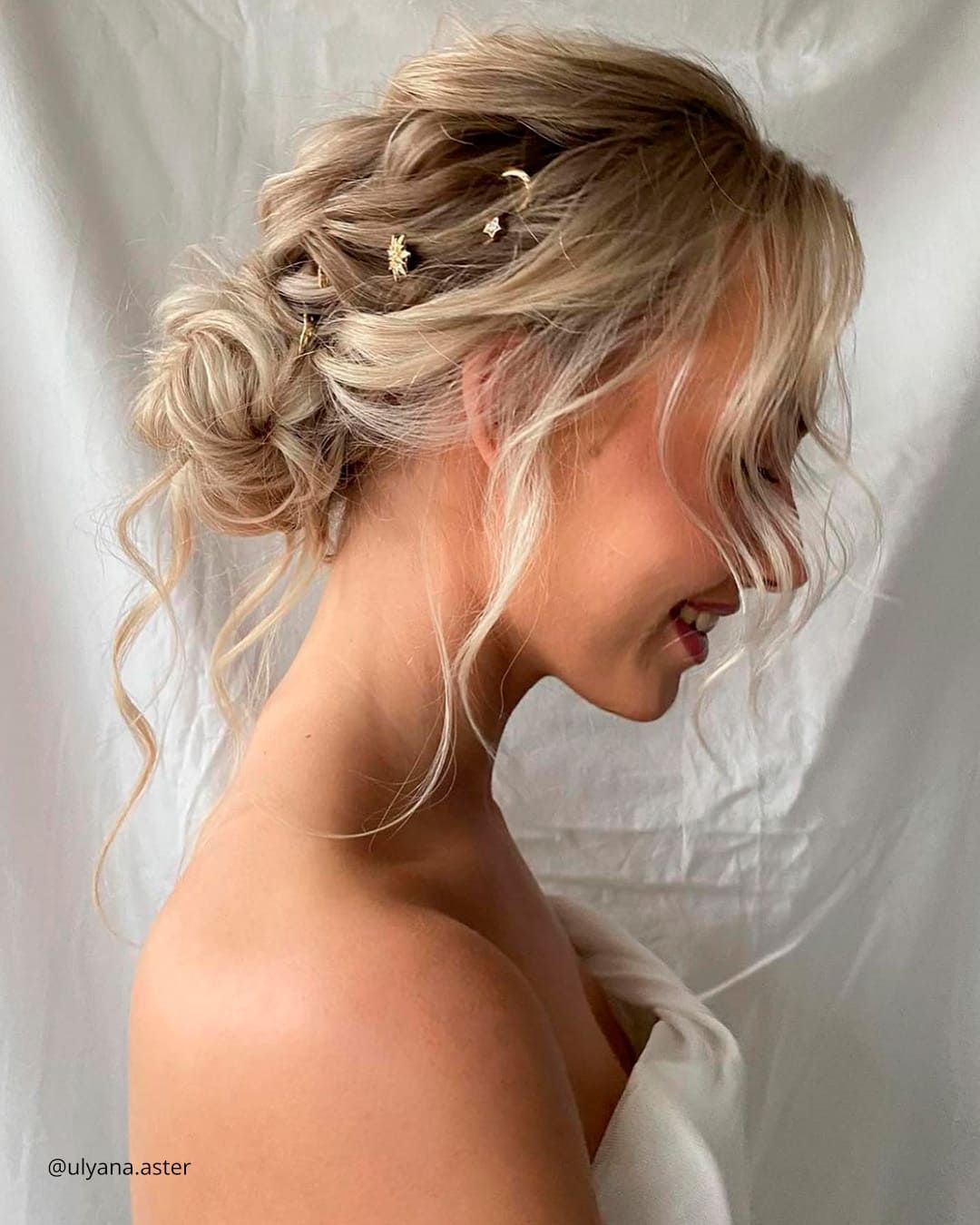Messy Blonde Updo with Side-Swept Bangs — Wedding Low Bun