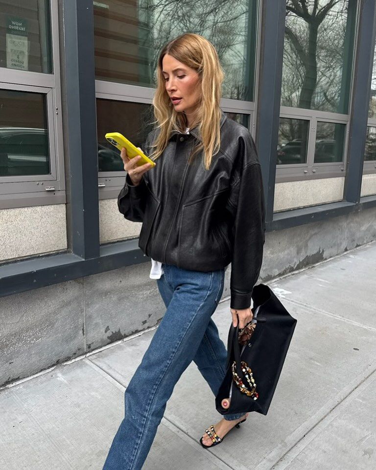 Street Style Statement: Medium Wash Bootcut Jeans with Bomber Jacket and Embellished Sandals Street Style Statement: Medium Wash Bootcut Jeans with Bomber Jacket and Embellished Sandals — Bootcut Jeans Outfits