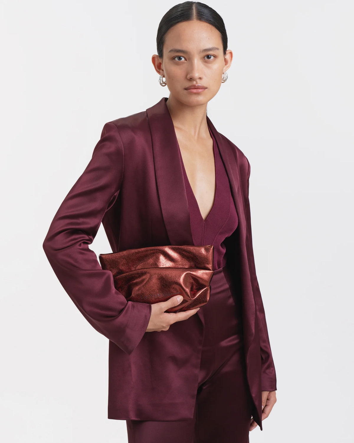 Chic Burgundy Satin Suit with a Metallic Bronze Clutch — Clutch Outfits