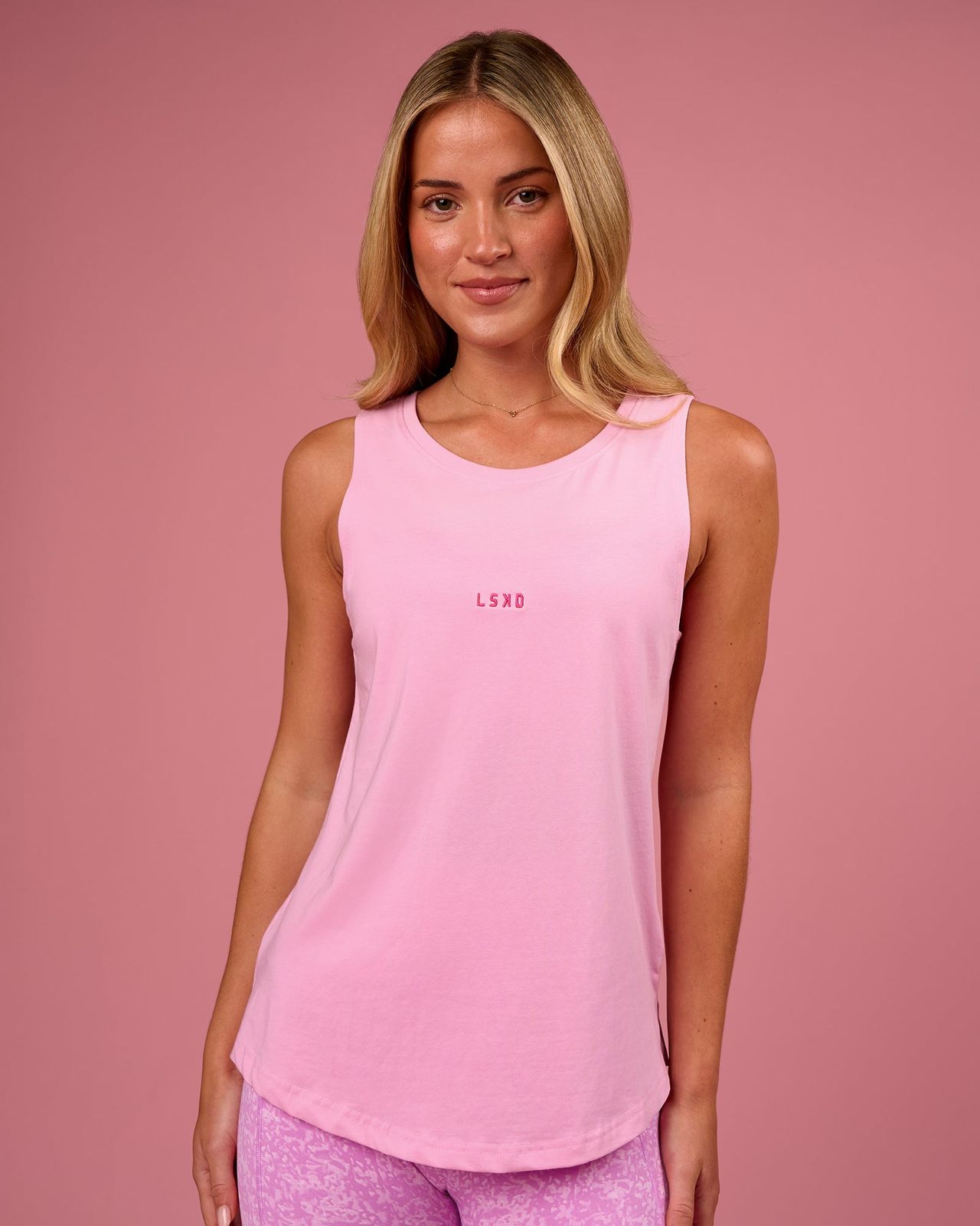Vibrant Athleisure: Pink Relaxed Tank Top — Tank Tops