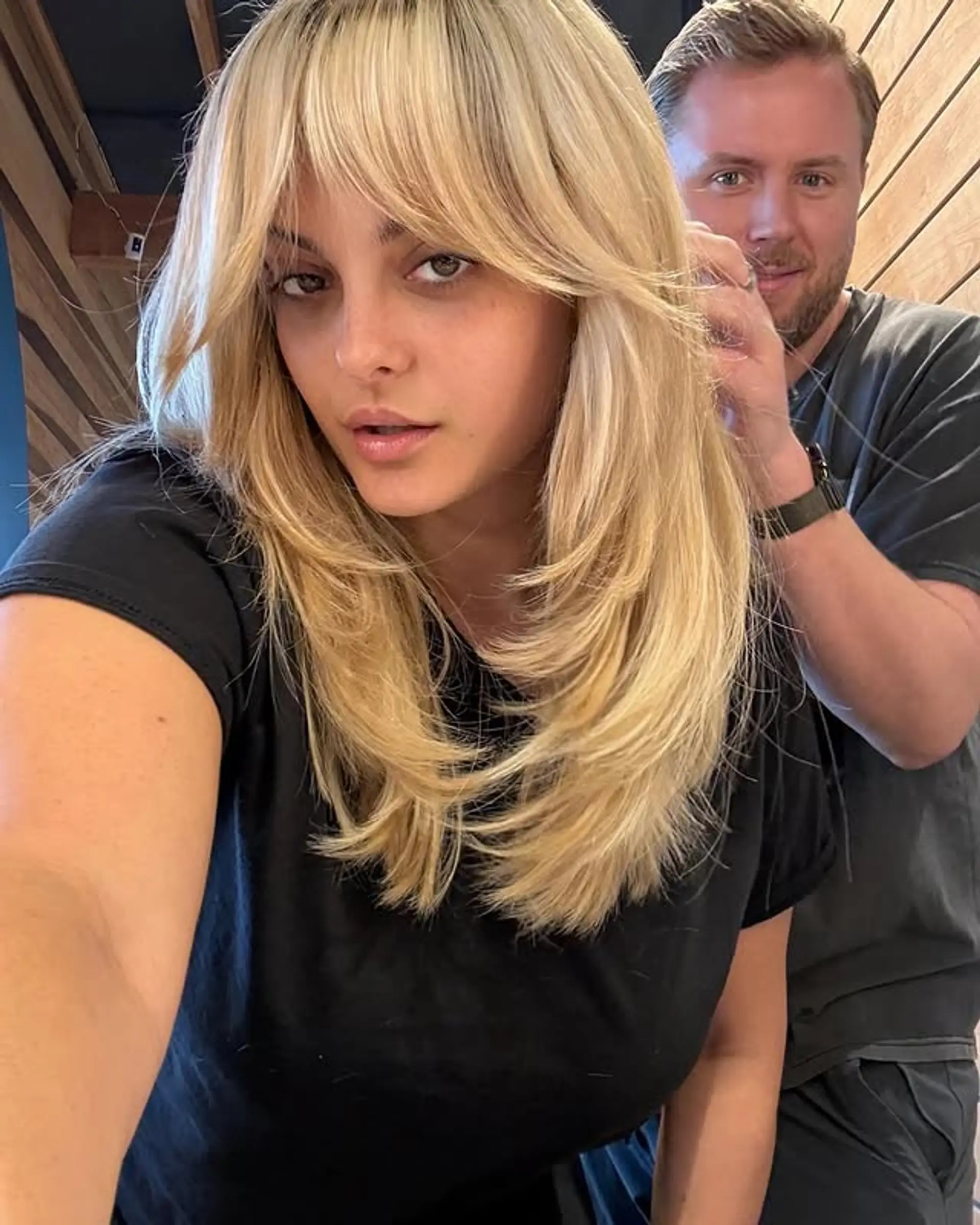 Salon Fresh: Blonde Hair with Heavy Bangs and a Black T-Shirt — Long Bangs