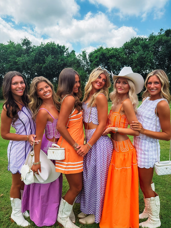 Playful Mix of Crop Tops, Skirts, and Dresses with Cowboy Boots Playful Mix of Crop Tops, Skirts, and Dresses with Cowboy Boots — Graduation Party Outfits