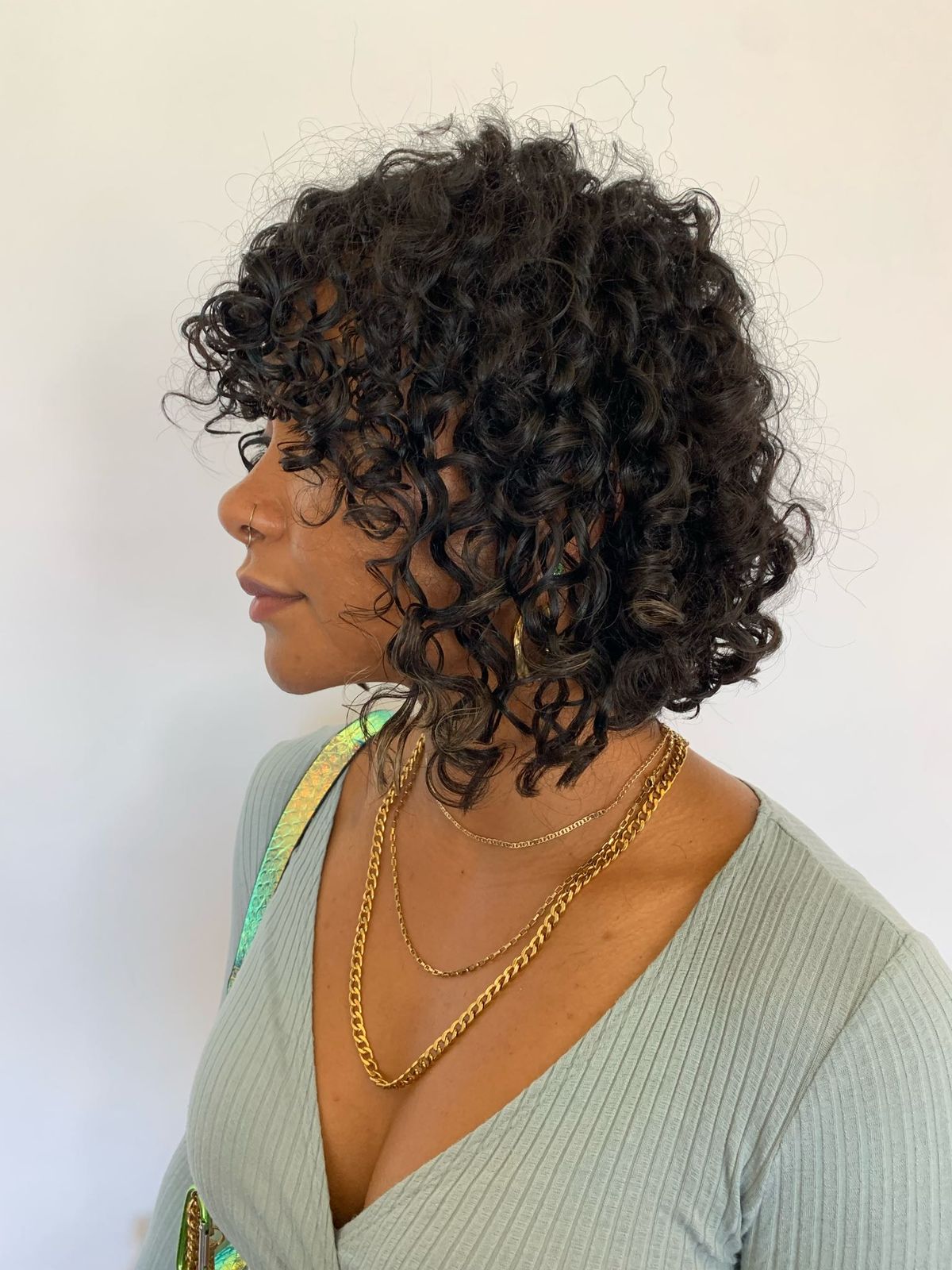 Chin Length Bob Defined Curls Side View — Short Curly Haircuts