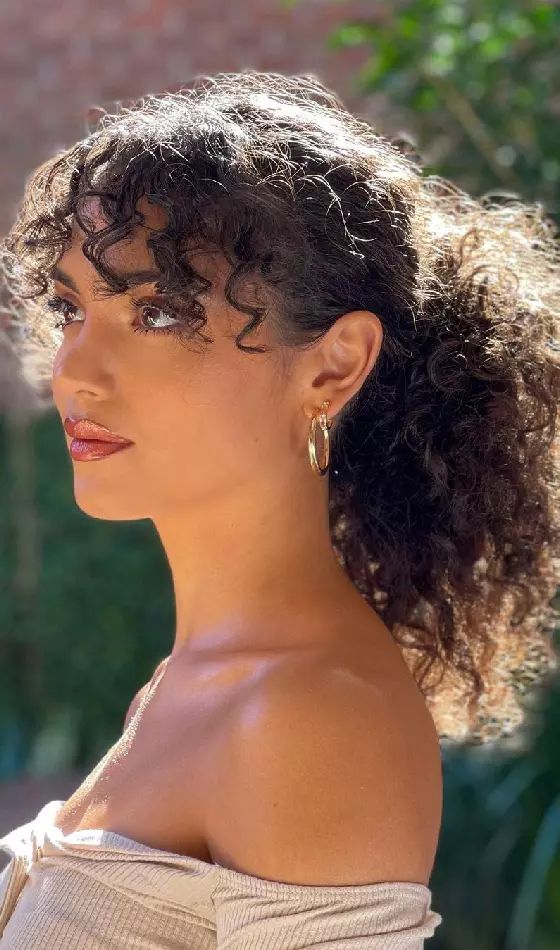 Puff Ponytail with Caramel Highlights and Bangs