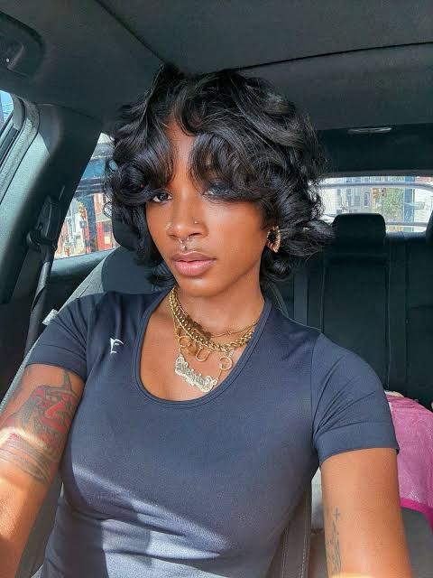Voluminous Black Wavy Pixie — Hairstyles for Growing Out a Pixie