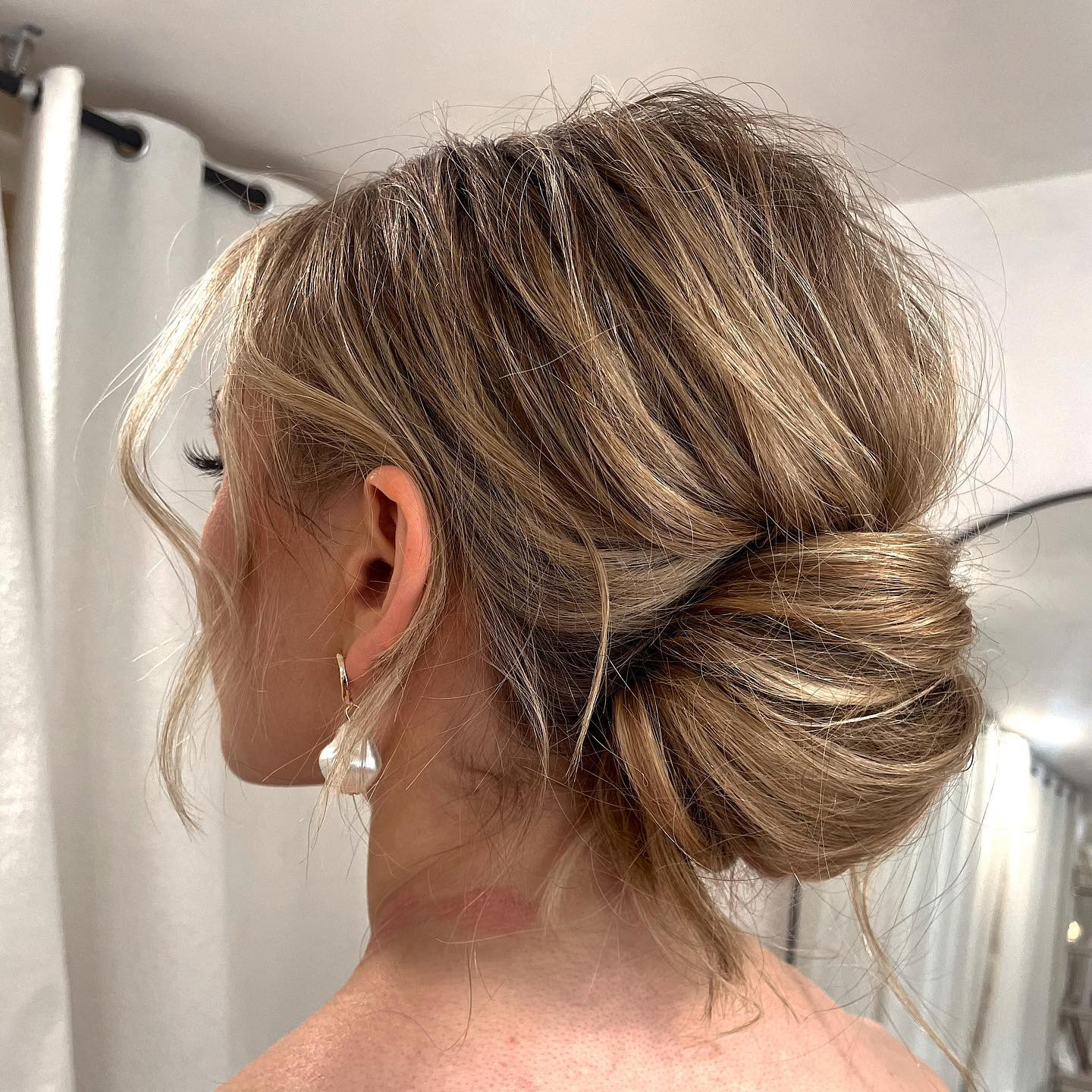 Loose Honey Blonde Messy Bun Loose Honey Blonde Messy Bun — Low Bun with Curtain Bangs