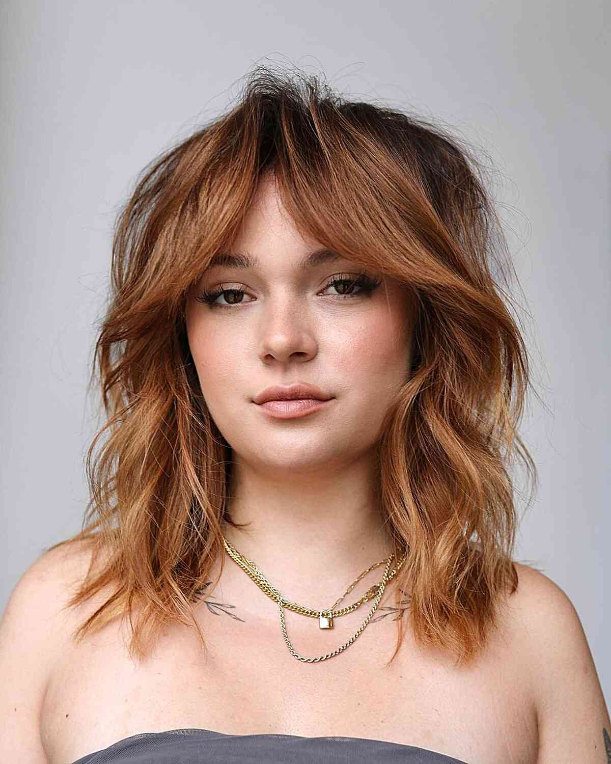 Collarbone Shag With Textured Curtain Bangs — Hairstyles for Growing Out Bangs