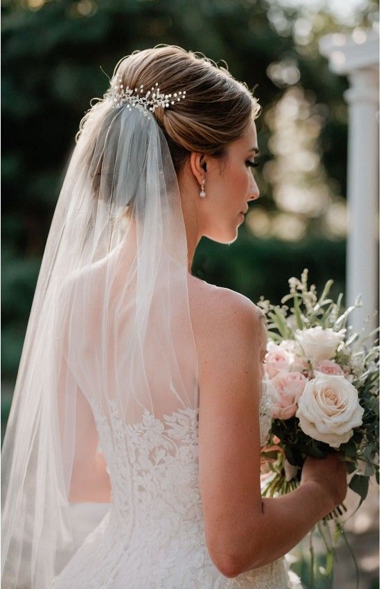 Sleek Blonde Low Updo With Pearls Sleek Blonde Low Updo With Pearls — Boho Wedding Hair