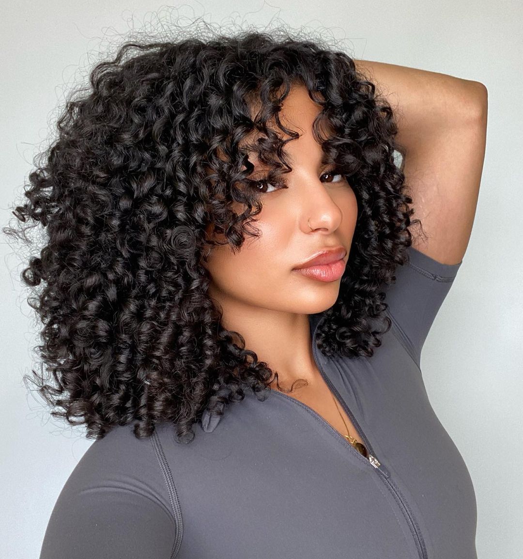 Collarbone Curly Hair With Voluminous Bangs — Natural Hair with Bangs