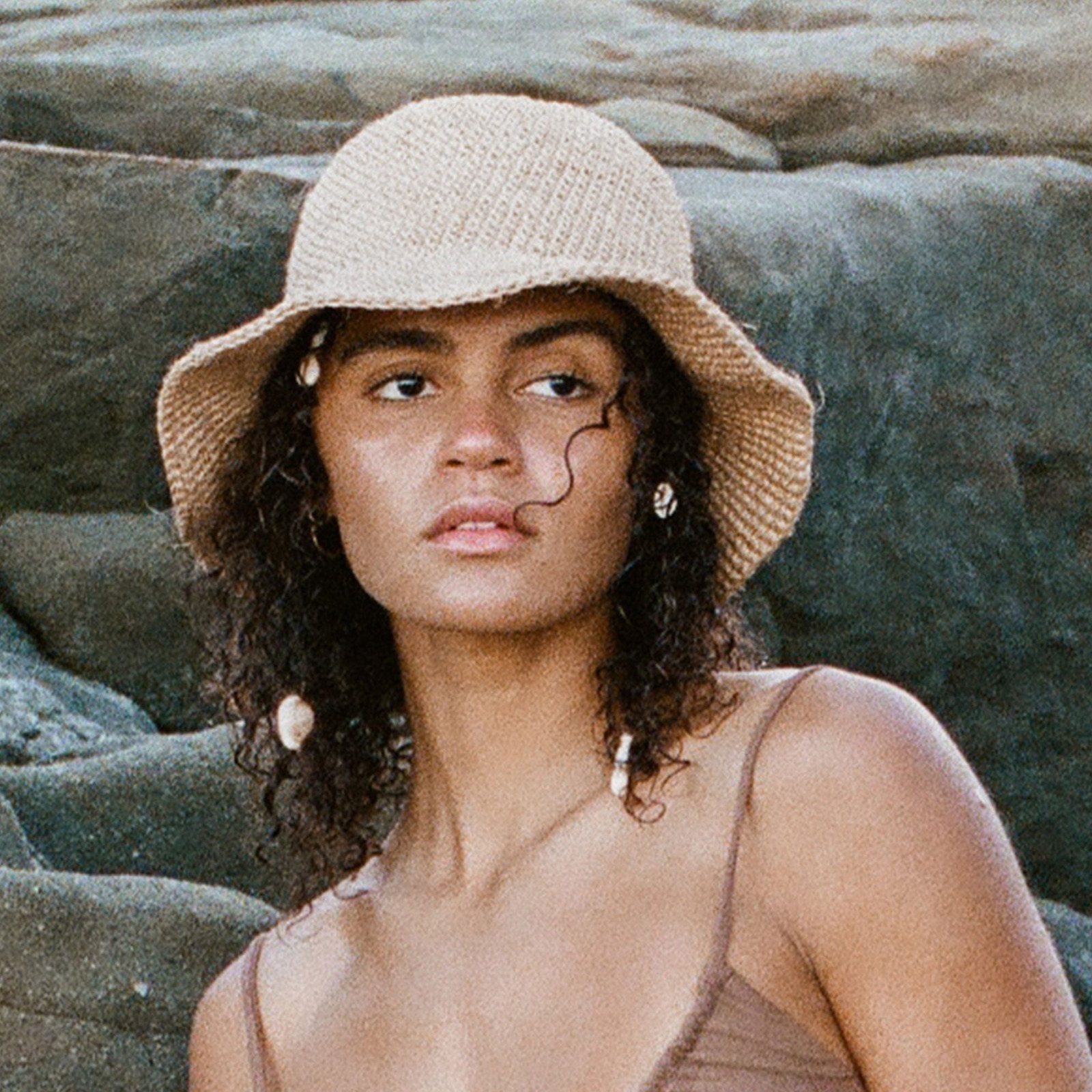 Shoulder-Length Curly Dark Brown with Crocheted Hat Shoulder-Length Curly Dark Brown with Crocheted Hat — Bucket Hat Hairstyles