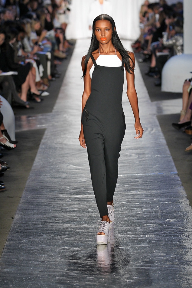 Sleek Black Jumpsuit-Style Overalls with White Tank and Platform Sneakers Sleek Black Jumpsuit-Style Overalls with White Tank and Platform Sneakers