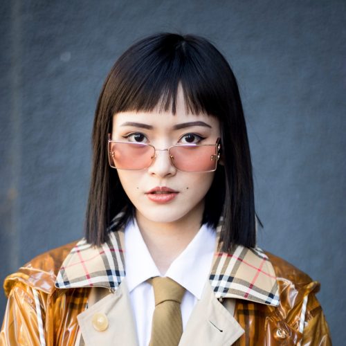 Vinyl Trench Coat Over Plaid with Pink Sunglasses Vinyl Trench Coat Over Plaid with Pink Sunglasses — Baby Bangs