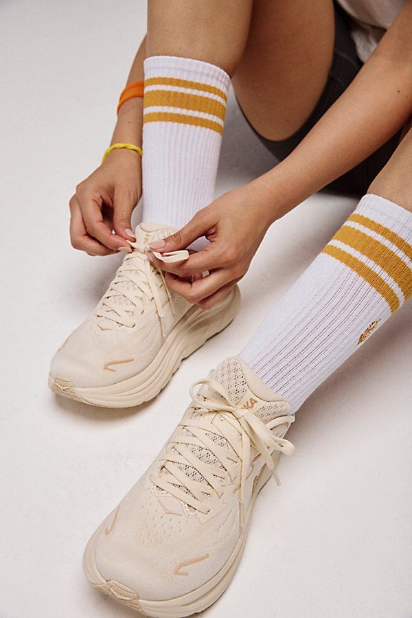 Beige Hoka Sneakers with Striped Athletic Socks Beige Hoka Sneakers with Striped Athletic Socks — Hoka Outfits