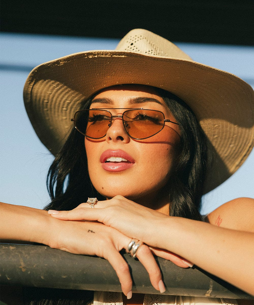 Outdoor Charm with Brown Aviators and Straw Hat — Aviator Sunglasses Women