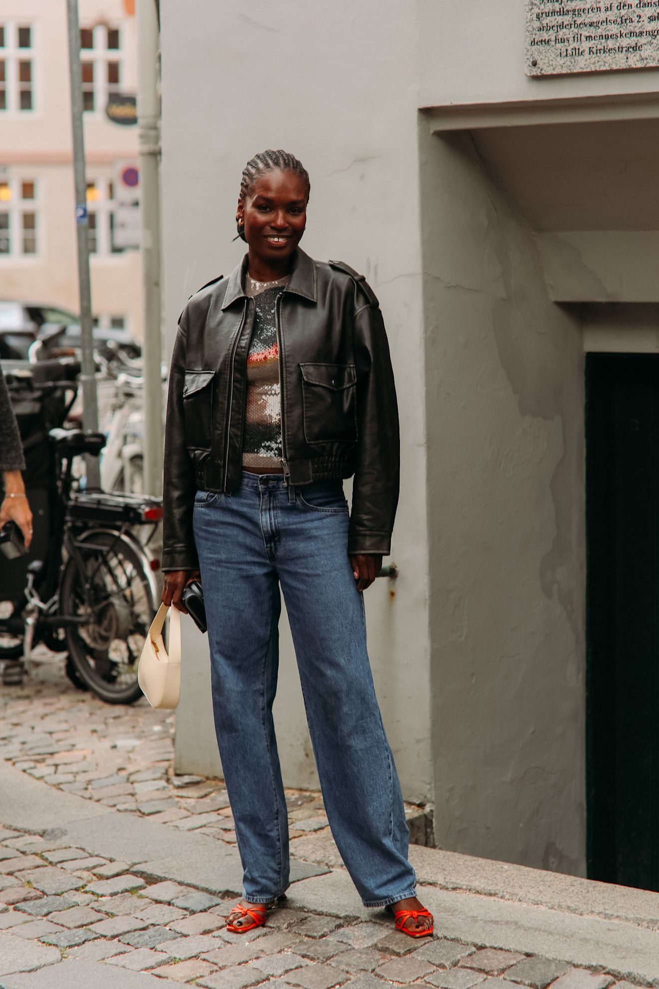 Brown Leather Bomber Jacket with Patterned Top and Jeans — Leather Jacket Outfits