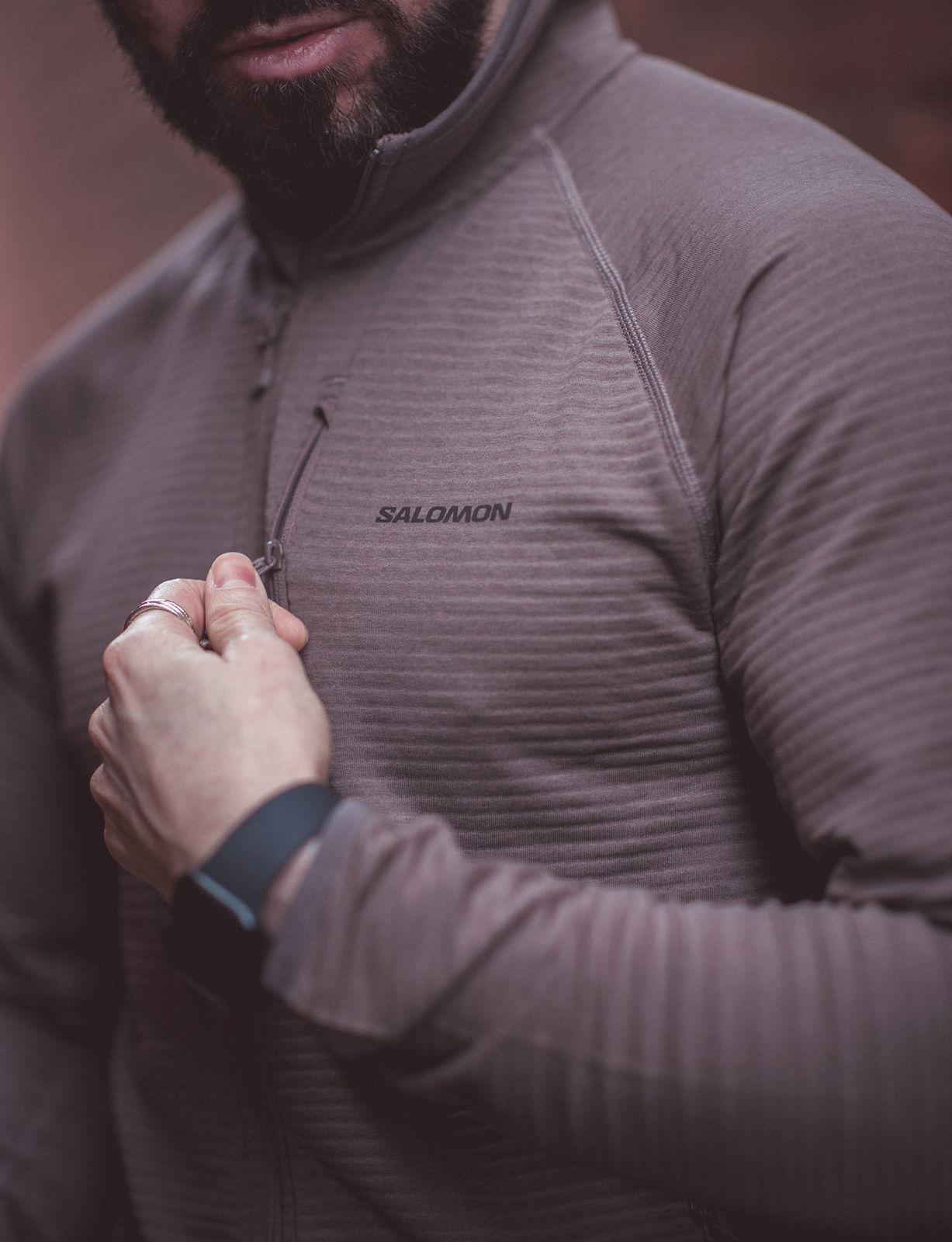 Logo Detail: Taupe Fleece Jacket with Visible Salomon Branding Logo Detail: Taupe Fleece Jacket with Visible Salomon Branding — Salomon Outfits