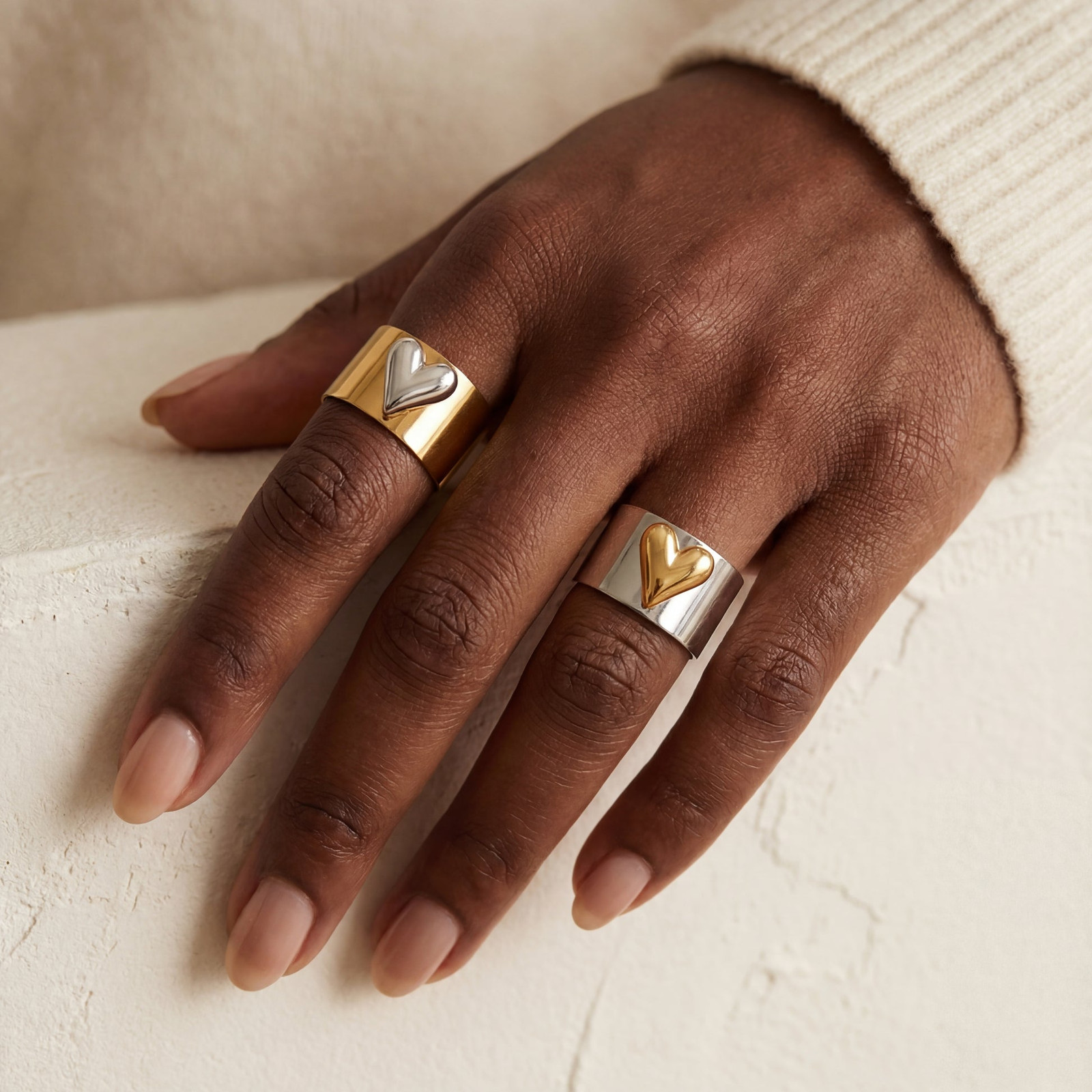 Heart Detail Mixed Metal Rings on Cream Sweater Heart Detail Mixed Metal Rings on Cream Sweater — Mixed Metal Jewelry
