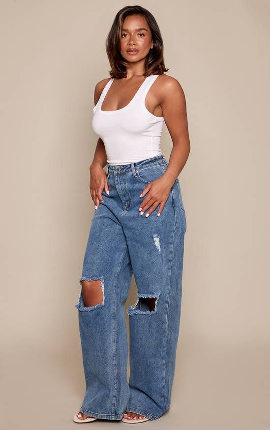 Wide-Leg Ripped Jeans with Simple Tank and Flip-Flops