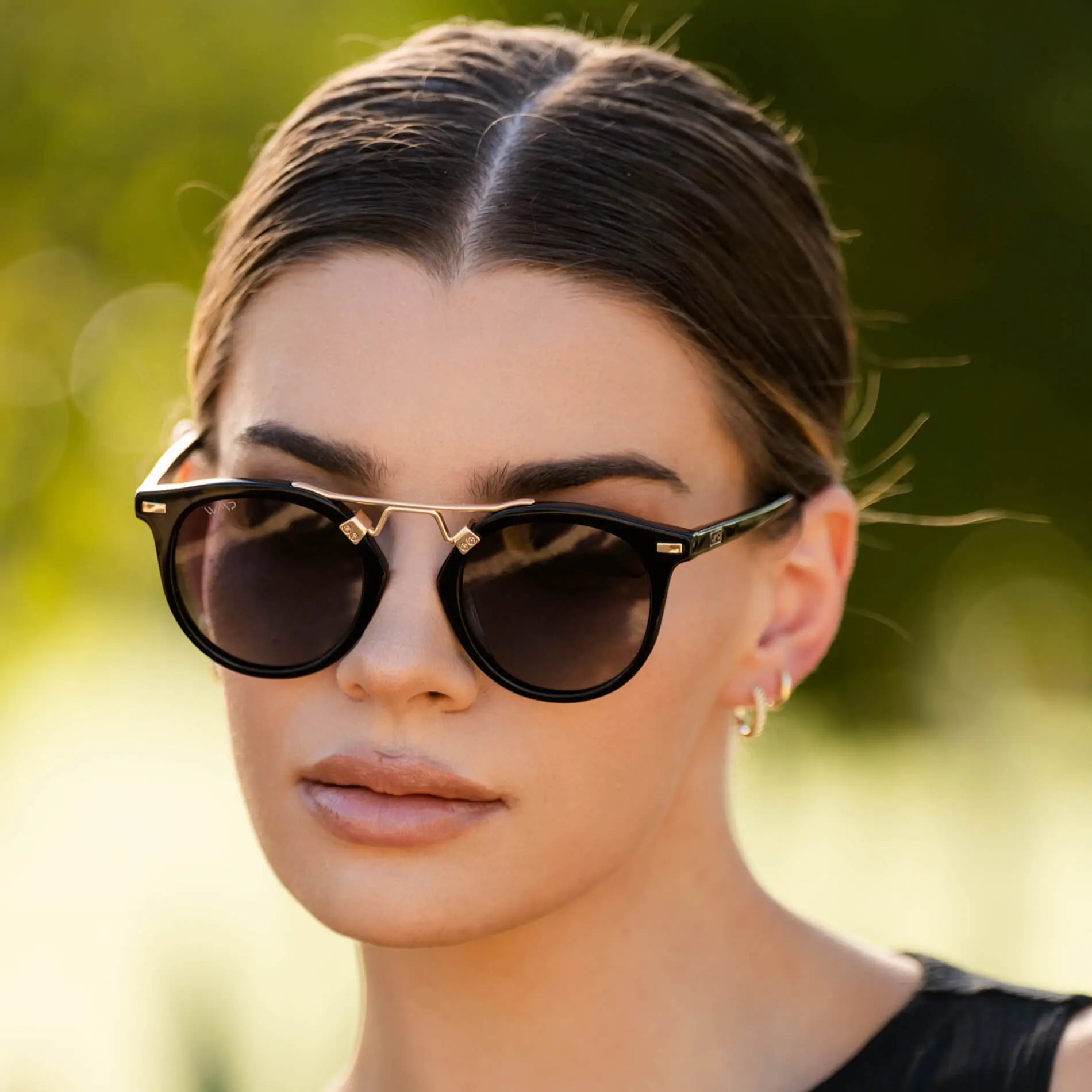 Minimalist Black Top with Gold Accents — Round Sunglasses Outfits