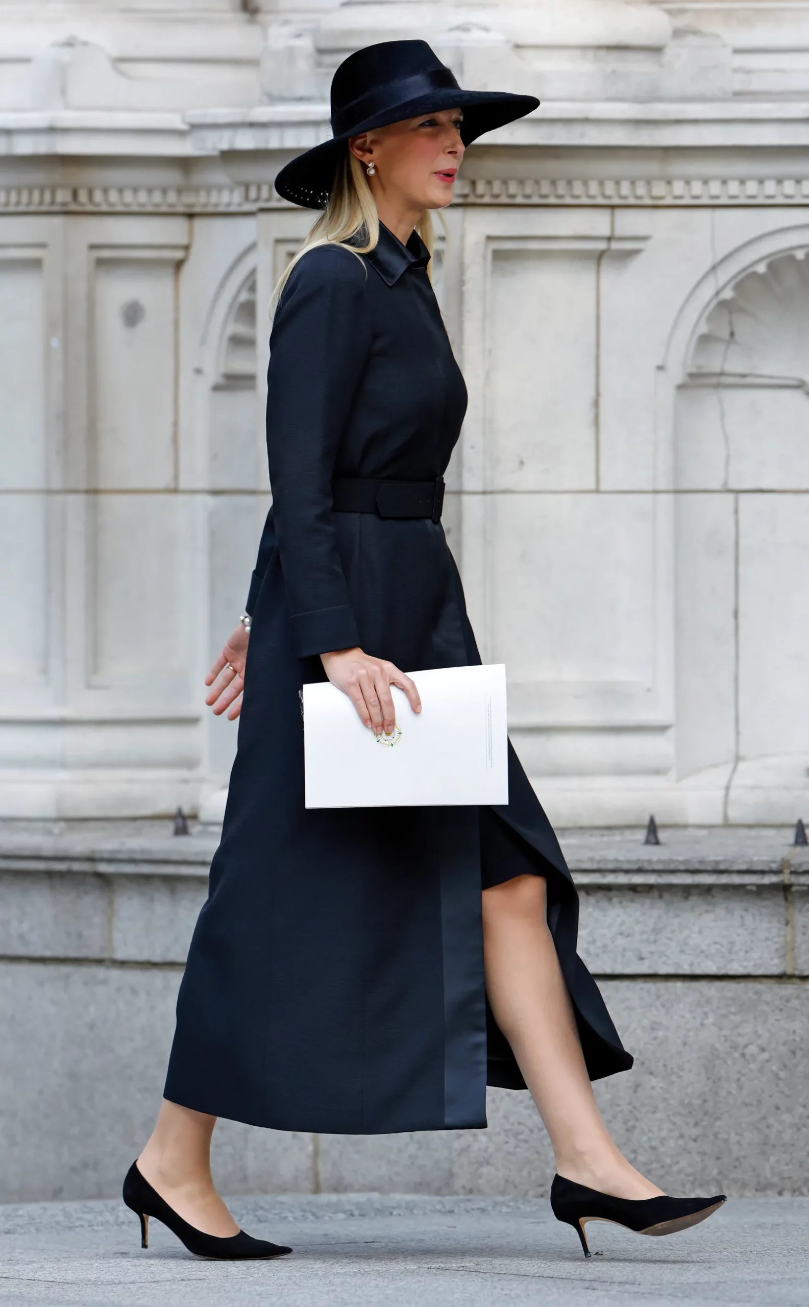 Belted Black Coat with Wide-Brimmed Hat and White Clutch Belted Black Coat with Wide-Brimmed Hat and White Clutch — Funeral Outfits