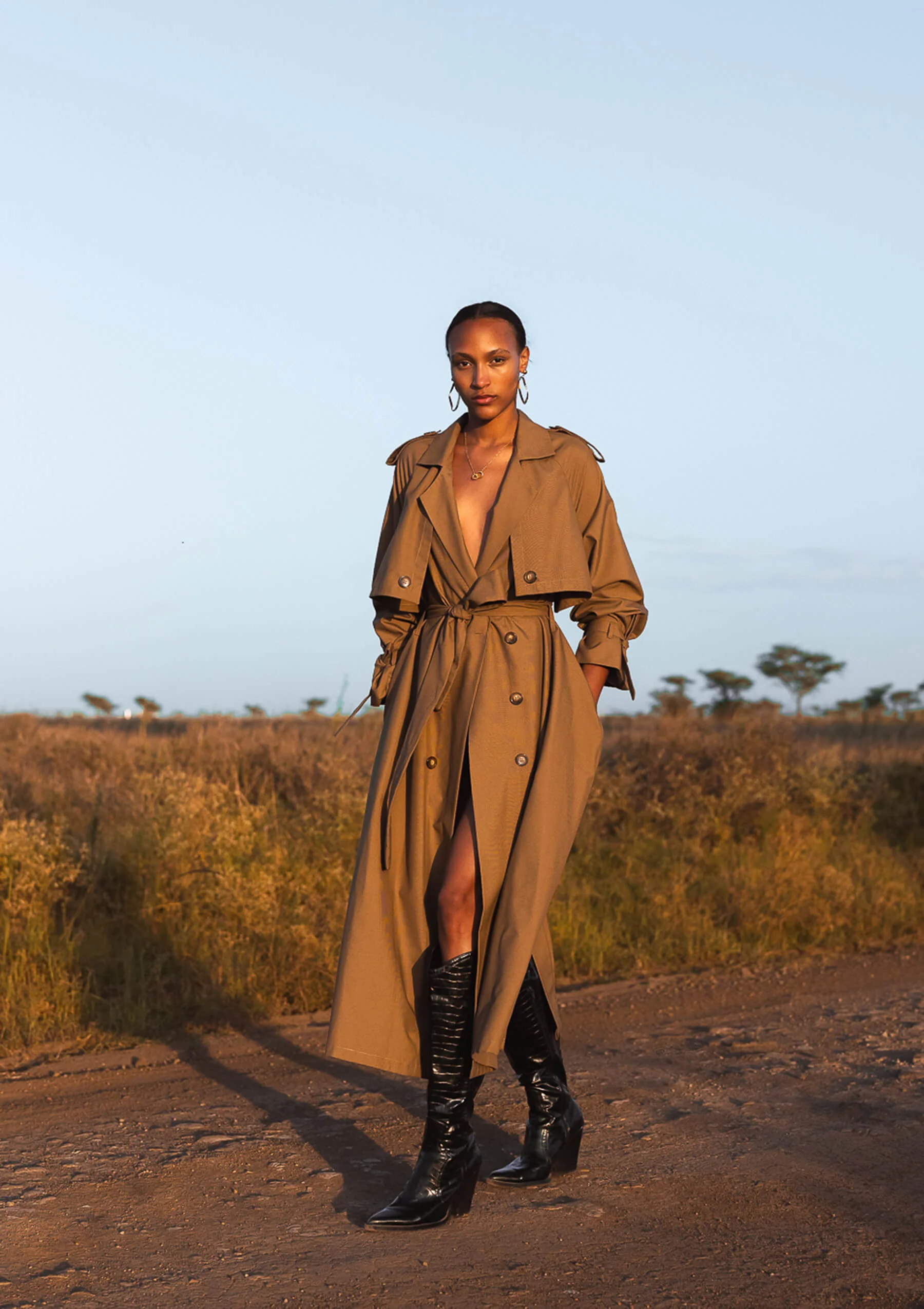 Long Beige Trench Coat with Black Knee-High Boots — Trench Coats