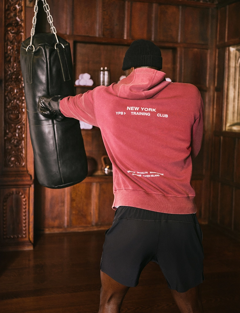 Dynamic Training: Reddish-Pink Hoodie with Graphic Text and Black Shorts — Mens Gym Outfits