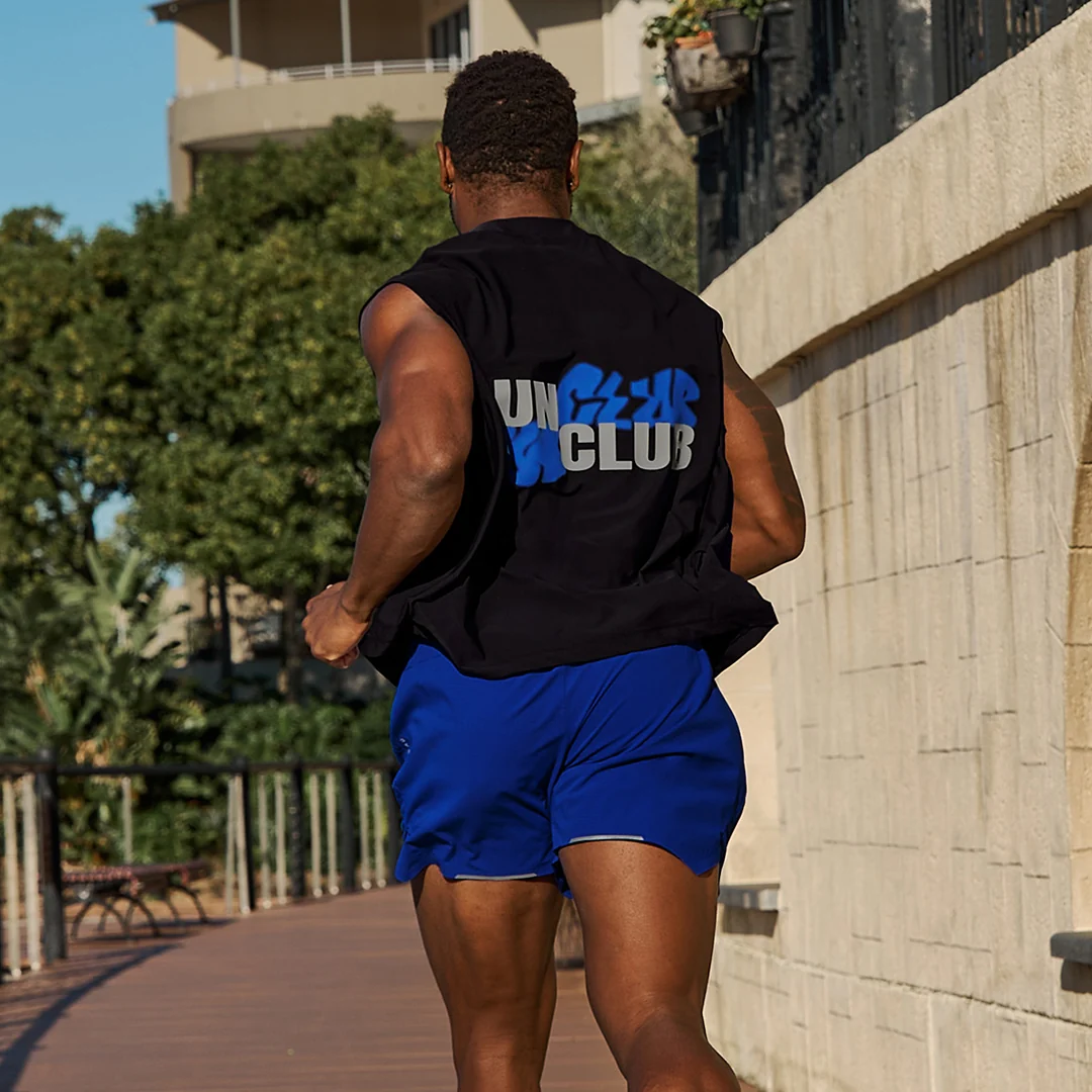 Running Performance: Black Sleeveless Tee with Blue Graphic and Royal Blue Shorts — Mens Gym Outfits