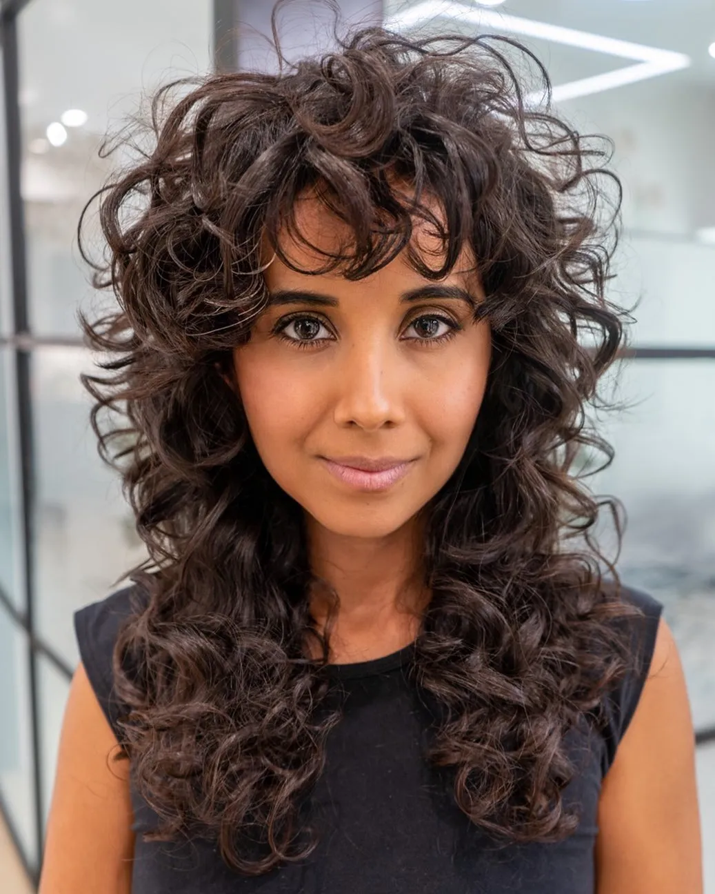 Shaggy Curly Bangs with Black Sleeveless Top Shaggy Curly Bangs with Black Sleeveless Top