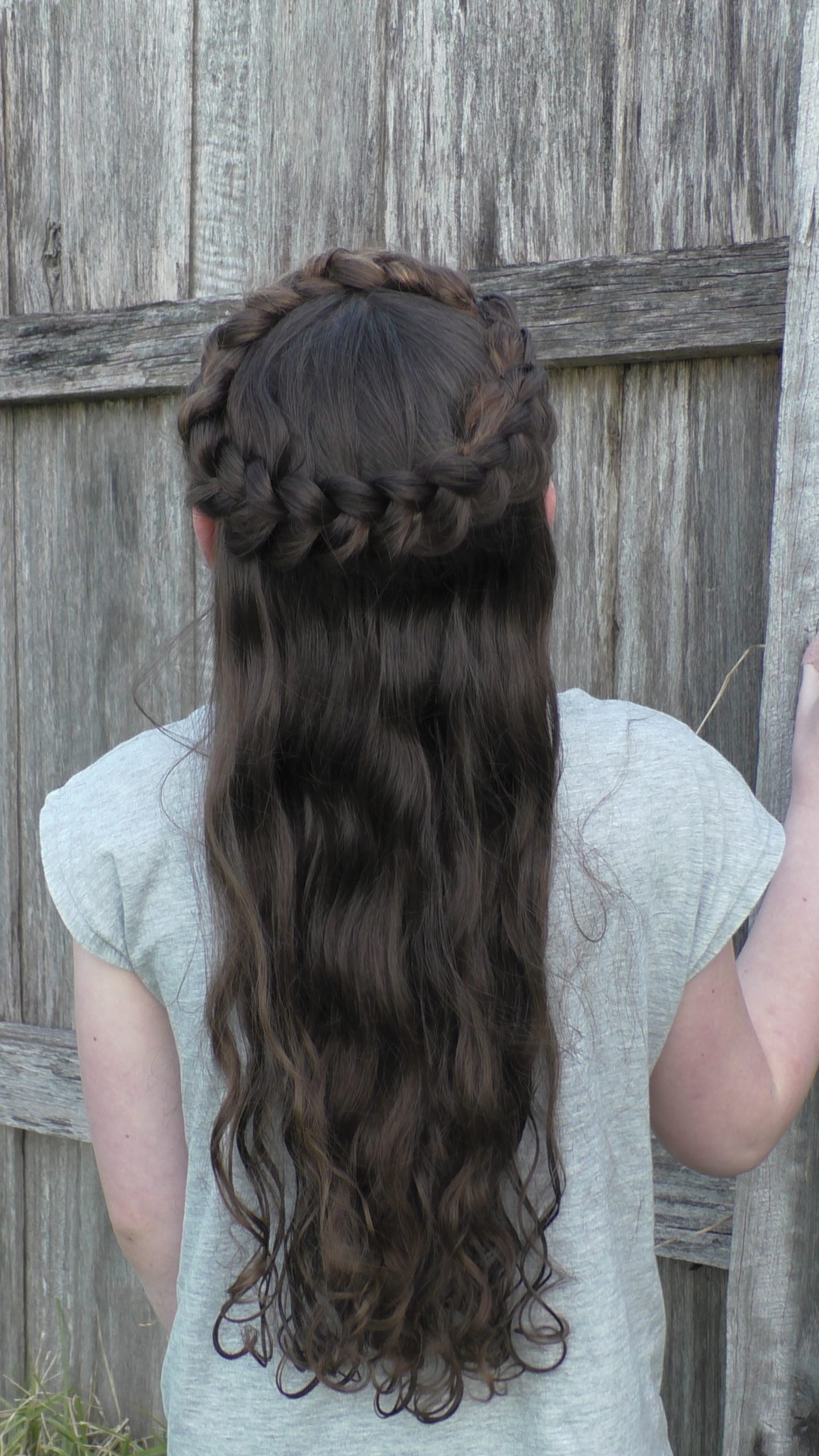 Dark Brown Crown Braid With Loose Waves