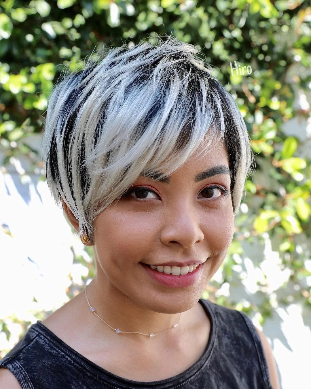 Textured Long Layered Pixie with Asymmetrical Side Swept Bangs and Platinum Blonde Highlights on Black Hair - The Latest Hairstyles for Men and Women (2020) - Hairstyleology