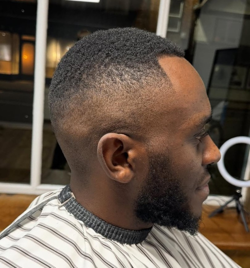 High Fade With Textured Wavy Top — Black Men Haircuts