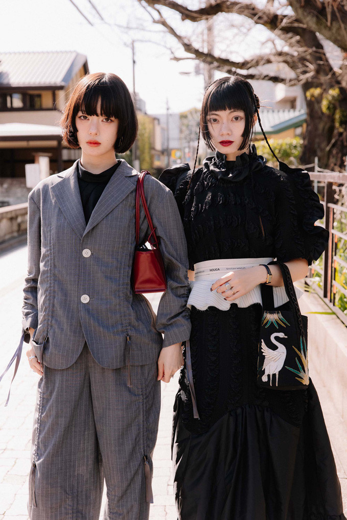 Chic Pinstripe Power Suit with a Bold Red Handbag Accent — Tokyo Outfits