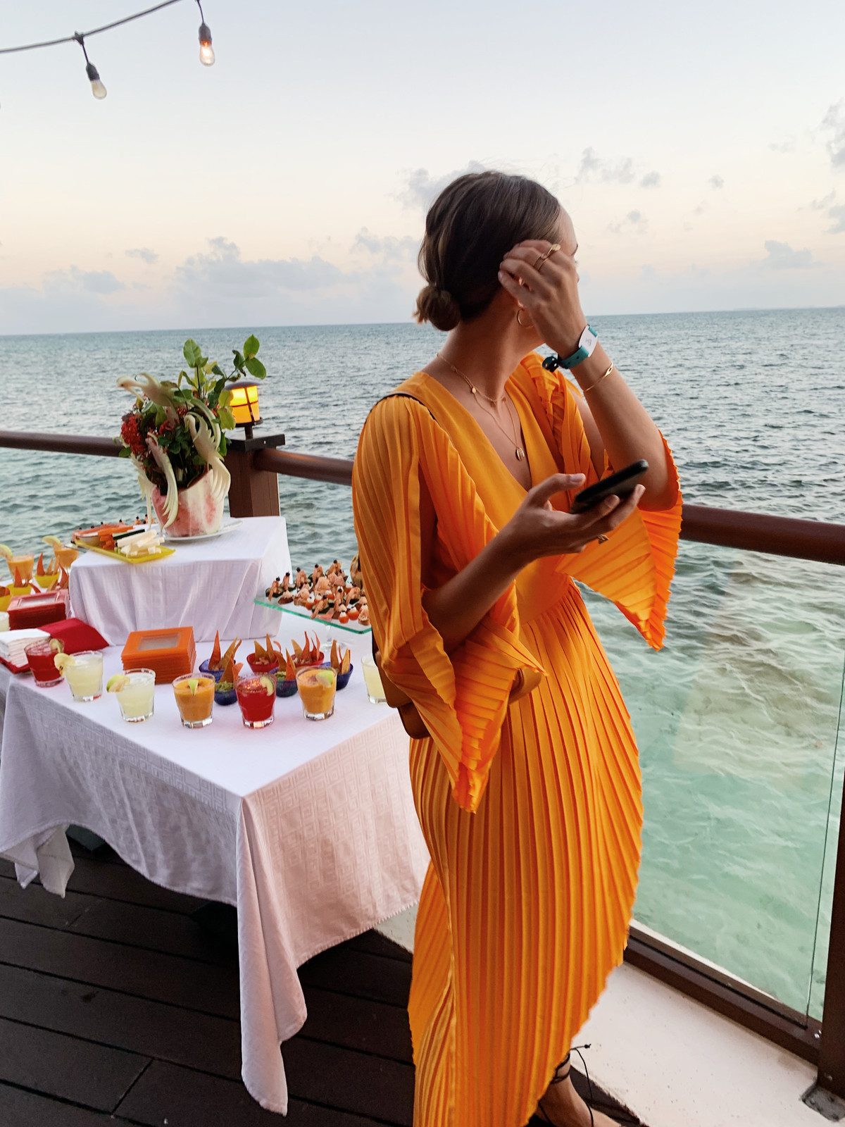 Dramatic Orange Pleated Dress for Sunset Resort Dinners Dramatic Orange Pleated Dress for Sunset Resort Dinners — Cancun Outfits