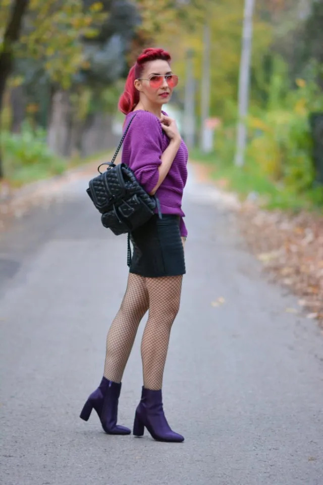 Bold Statement: Purple Sweater, Fishnets, and Quilted Backpack — Backpack Outfits Women