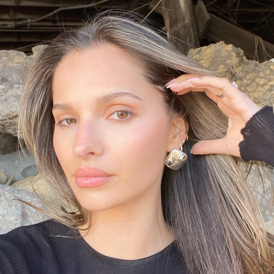 Sculptural Gold Hoop Earrings with a Black Ribbed Long-Sleeve Top Sculptural Gold Hoop Earrings with a Black Ribbed Long-Sleeve Top — Statement Earrings Outfits